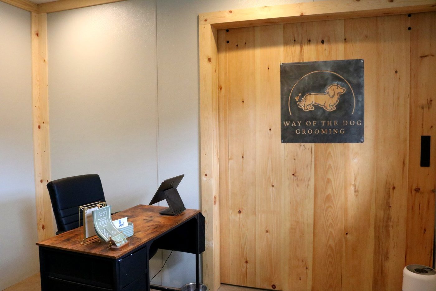 The front desk and Way of the Dog Grooming sign